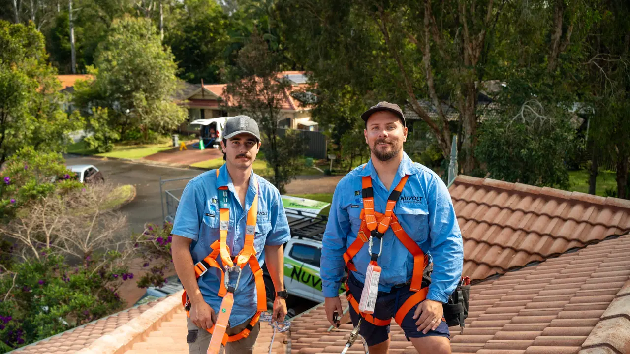 Dan and a Nuvolt team member beside the Nuvolt ute, with licence 92489 on the canopy