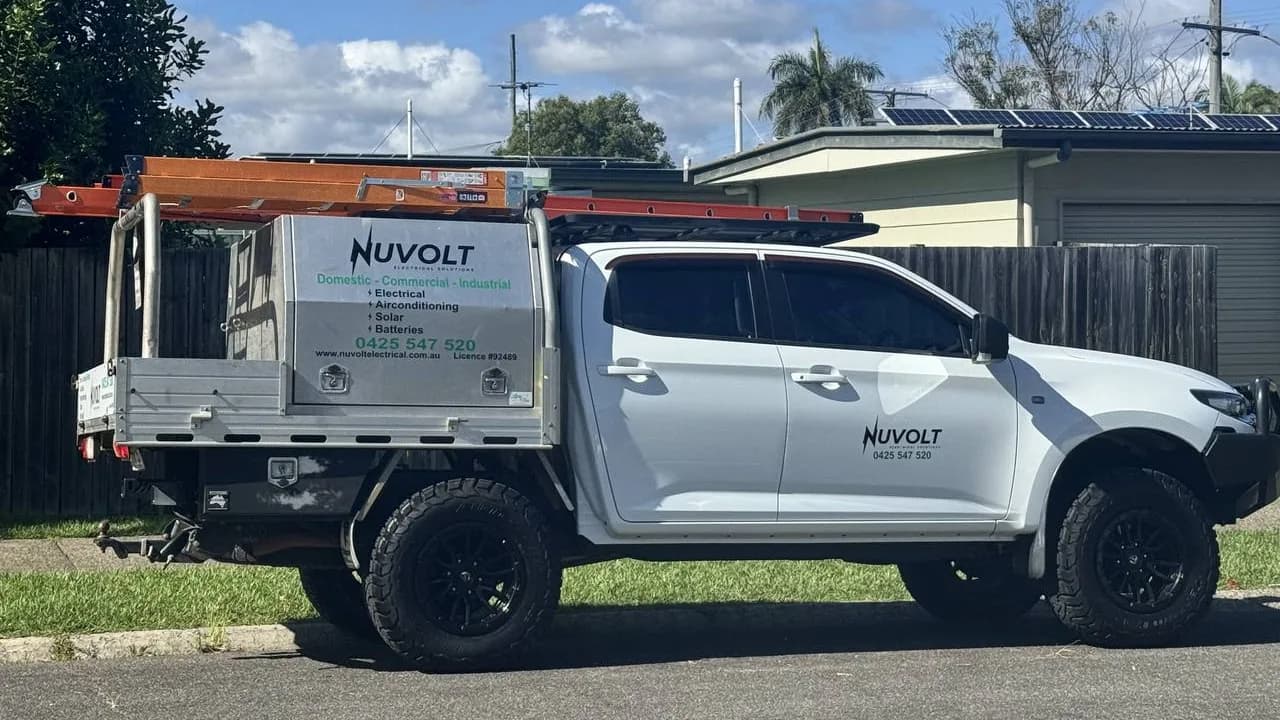 Nuvolt service ute loaded with ladders, parked on a Sunshine Coast street