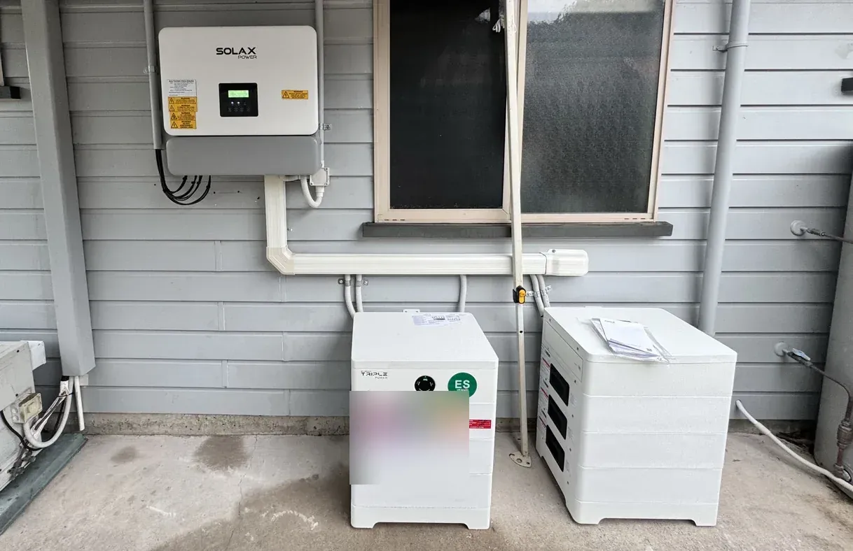 SolaX hybrid inverter and stacked home battery installed outdoors at a Coolum Beach home on the Sunshine Coast