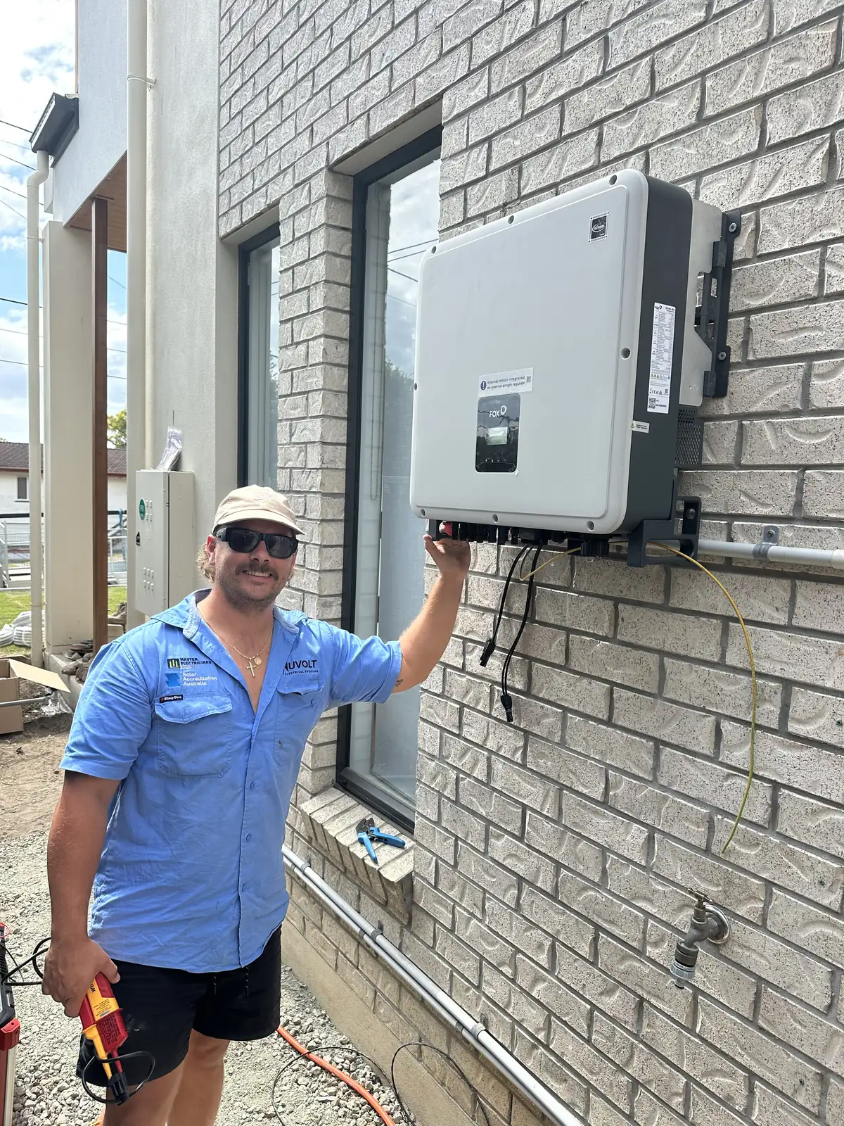 Daniel Carmont, Nuvolt founder, commissioning a Fox solar inverter on a residential install