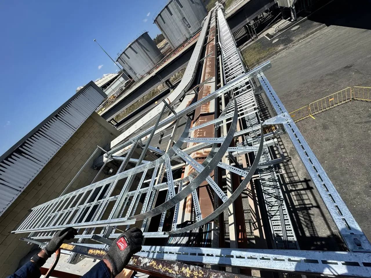 Galvanised cable ladder and tray feeding bulk storage silos
