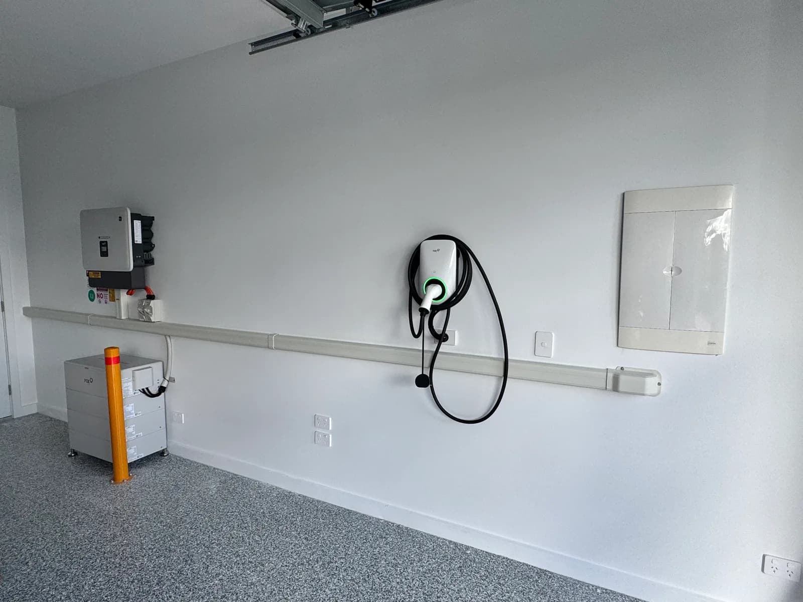 Fox wall EV charger with a FoxESS inverter and home battery installed in a Sunshine Coast garage