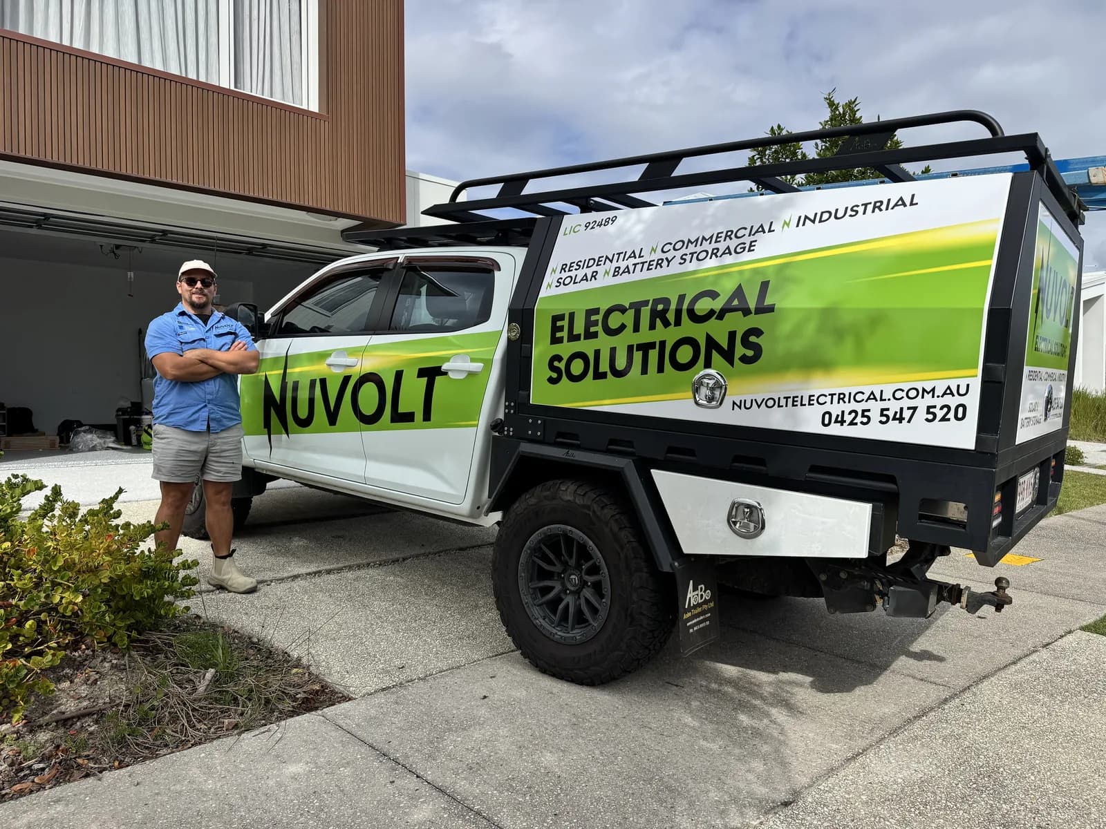 Nuvolt Electrical's signwritten ute with its new wrap, on site at a Sunshine Coast home