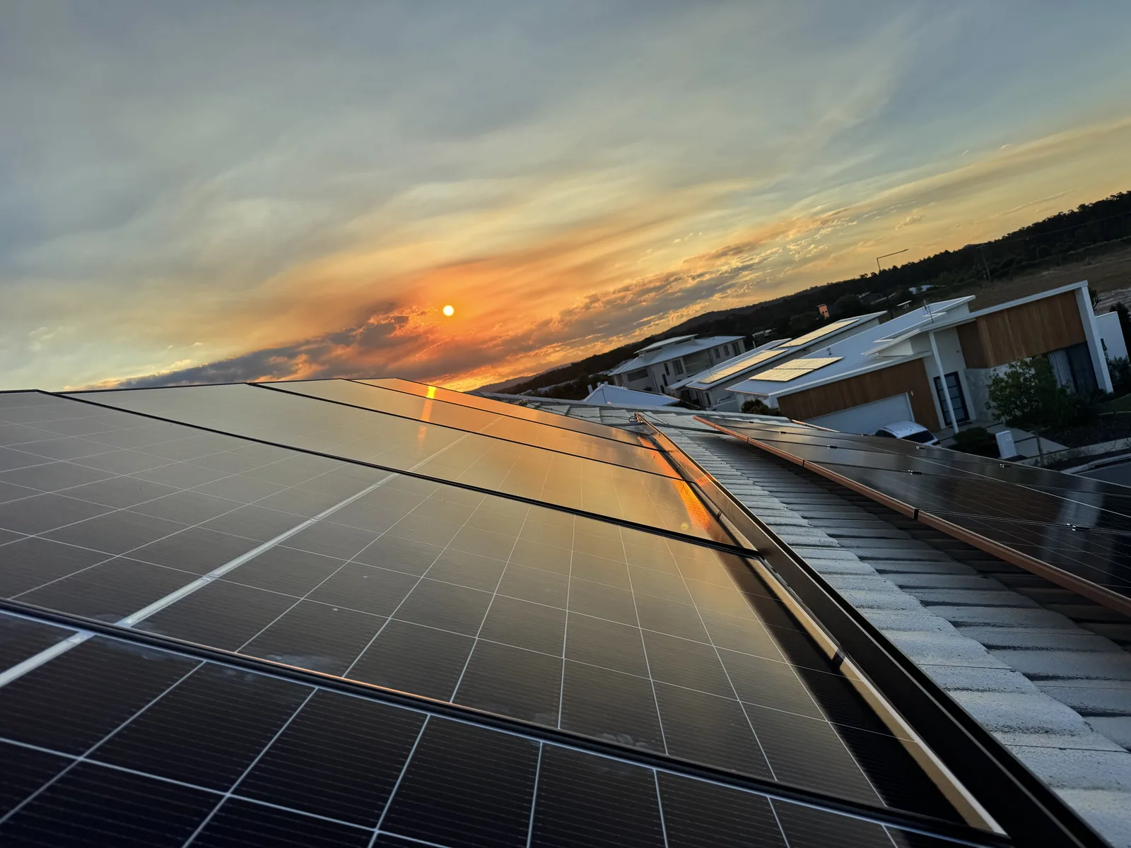 Clean rooftop solar array at sunset on a Sunshine Coast home, installed by Nuvolt Electrical