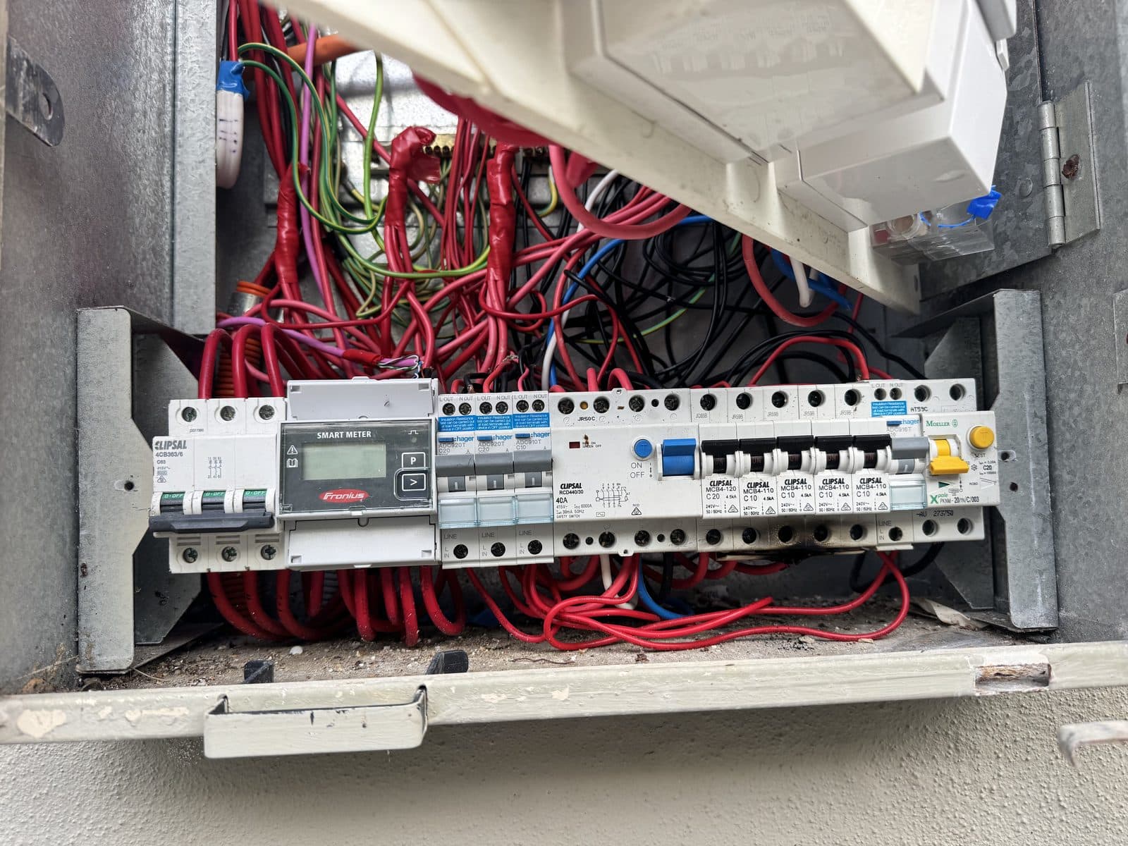 Switchboard with heat damaged circuit breakers, the kind of fault thermal imaging finds before it burns