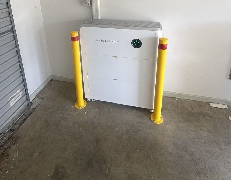 Floor standing Sigenergy battery stack with full safety signage