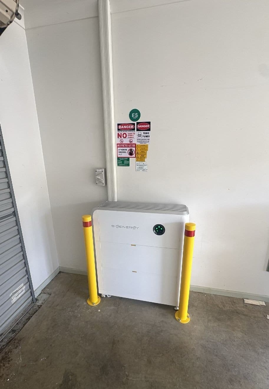 Floor-standing Sigenergy battery stack with full safety signage