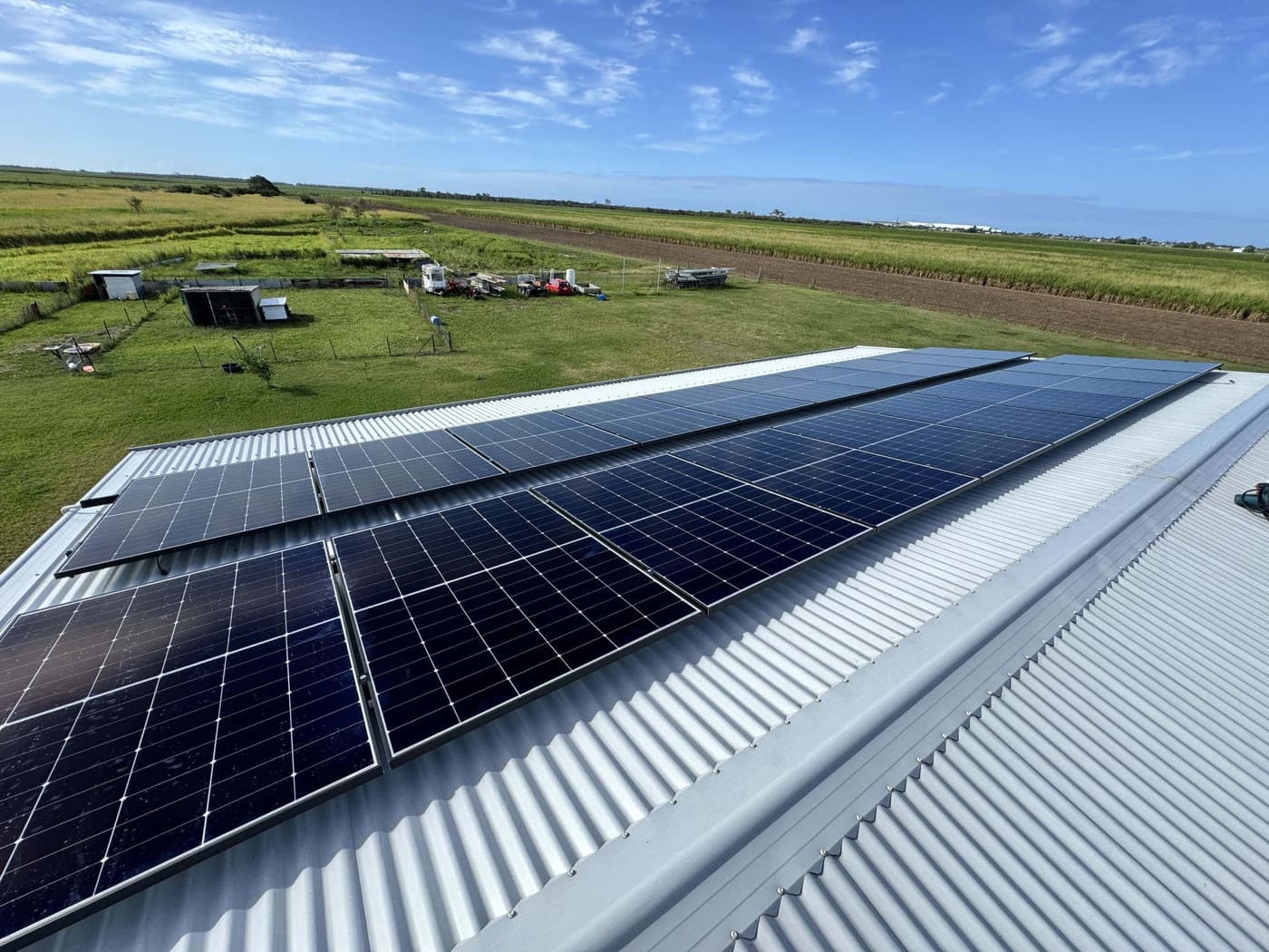 Aerial view of a full-length rooftop solar array installed by Nuvolt Electrical on a rural property in Fairymead, Bundaberg
