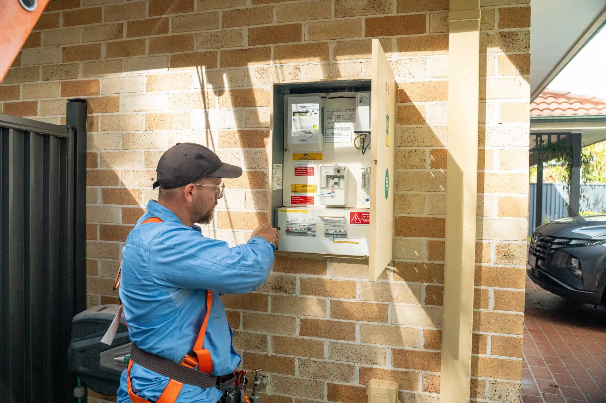 Dan from Nuvolt working on the switchboard in the meter box of a Sunshine Coast home