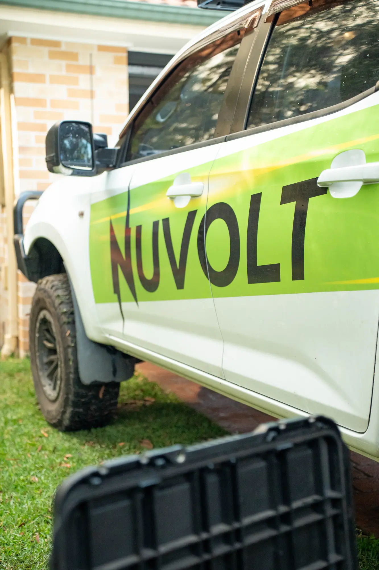 The Nuvolt ute in its new wrap, parked in the driveway of a Sunshine Coast home
