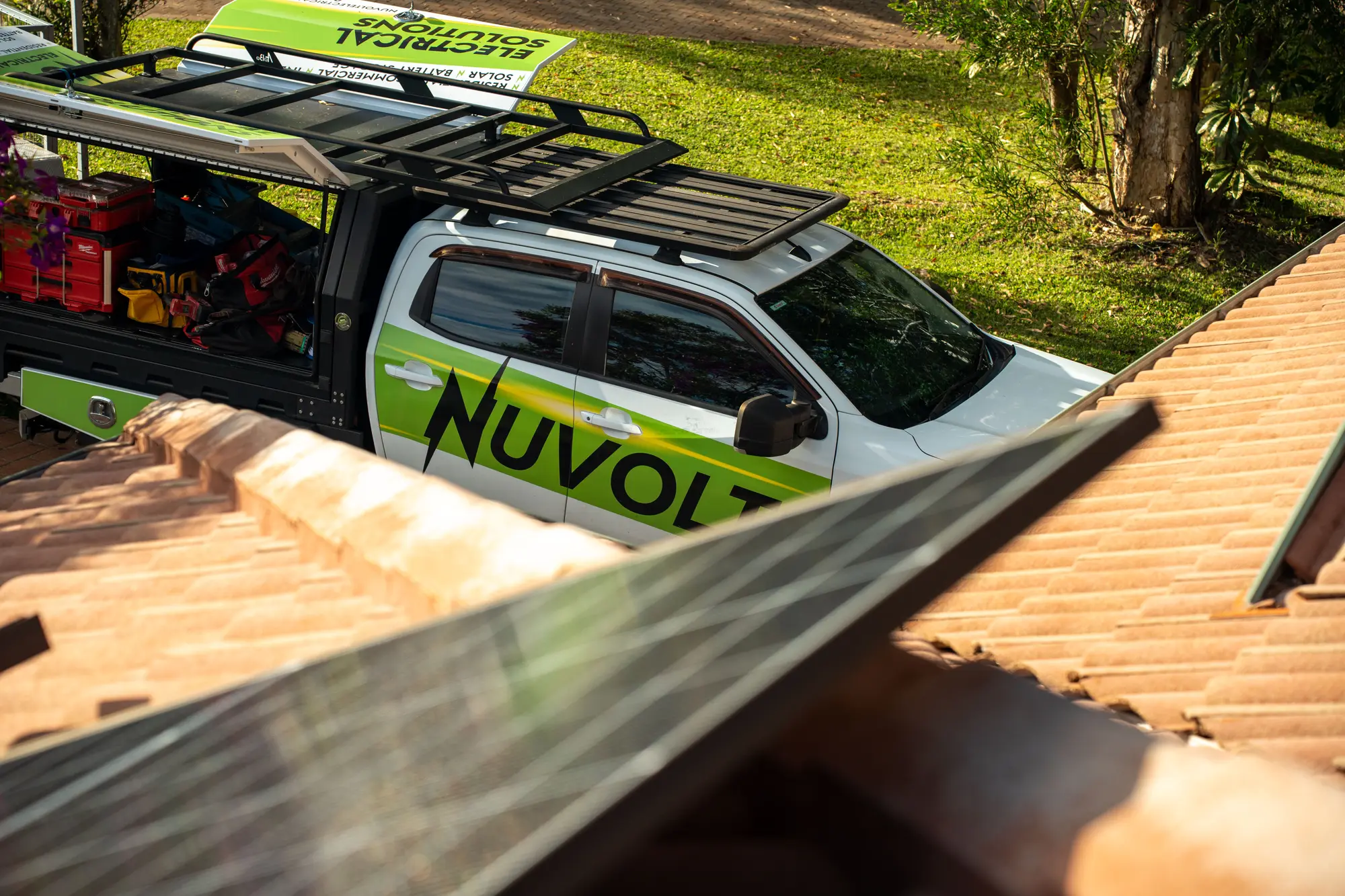 The Nuvolt ute seen from the roof, canopy open with the tools inside